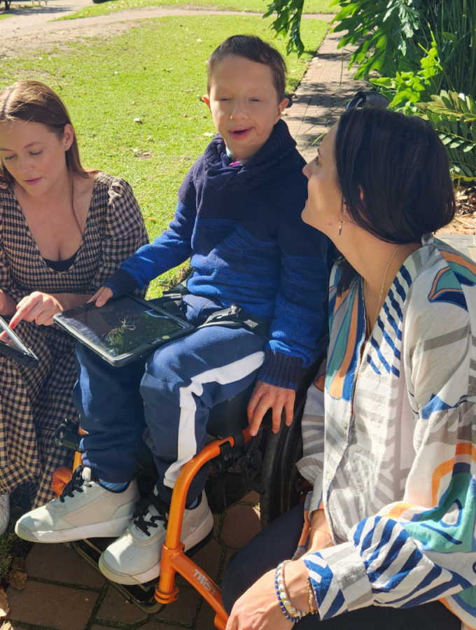 Our approach, your outcomes. Speech Pathologist with client and communication partner
